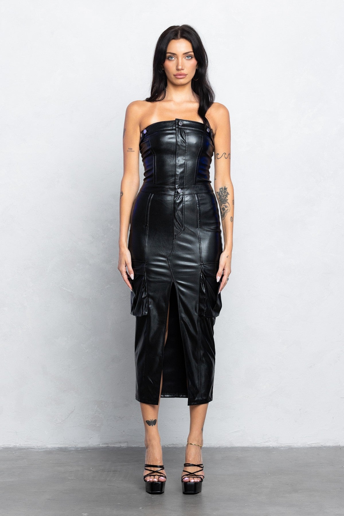 Black pleather bodycon midi dress with front zipper and slit, perfect for trendy night outs.