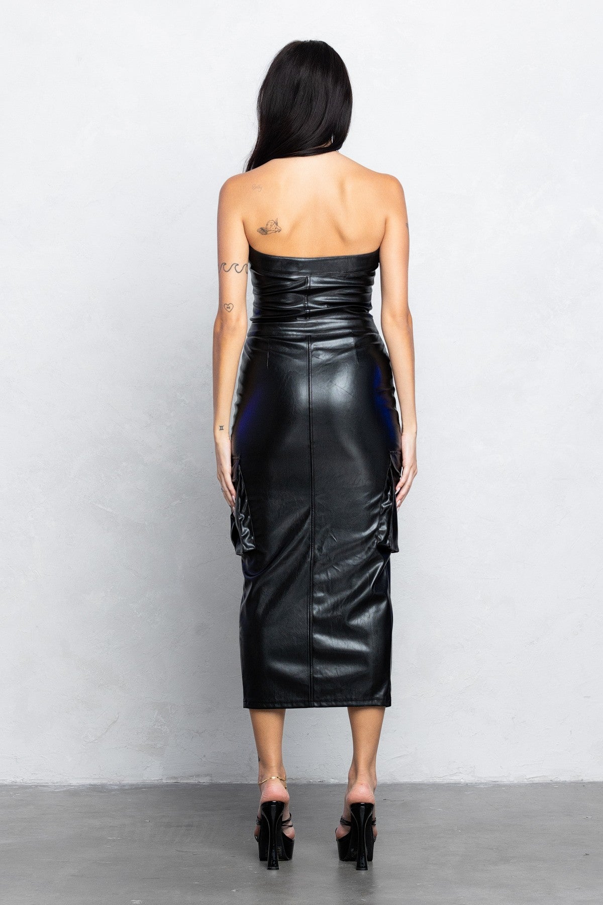 Black pleather bodycon midi dress with front zipper and slit, perfect for trendy night outs.