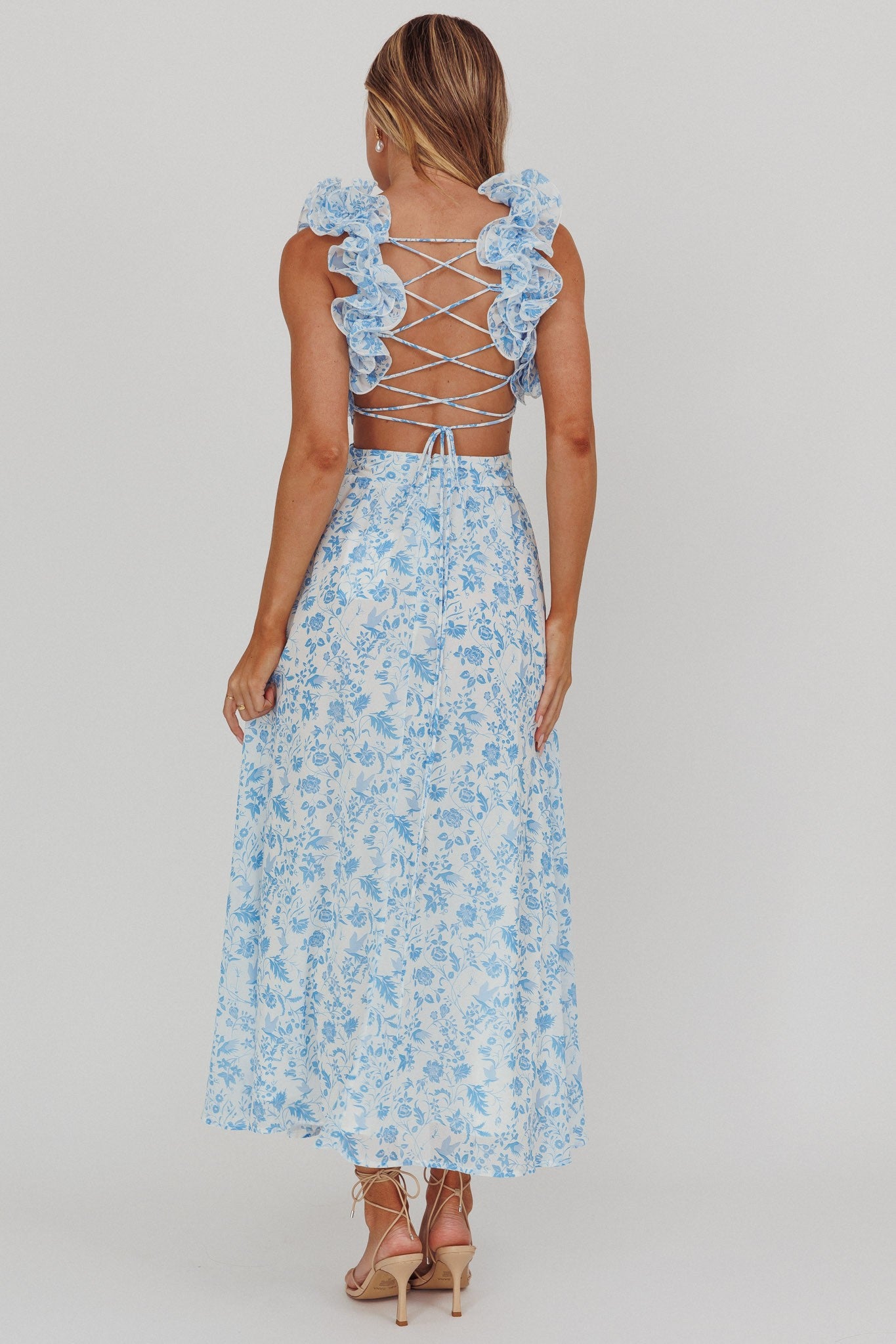 Sapphire Breeze Ruffle Strap Maxi Dress with v-neckline, criss-cross back tie, and flowy skirt in blue.