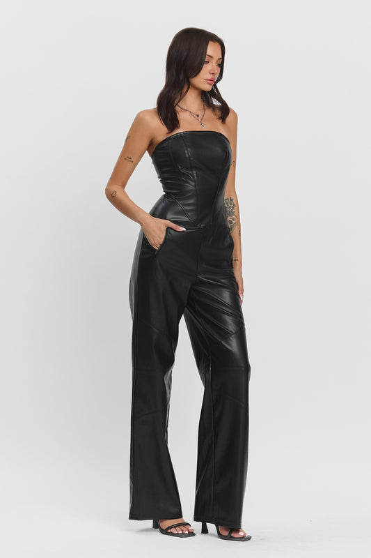 Starlit Muse Jumpsuit featuring a strapless fitted top, zipper pockets, and wide-legged pants in black faux leather.