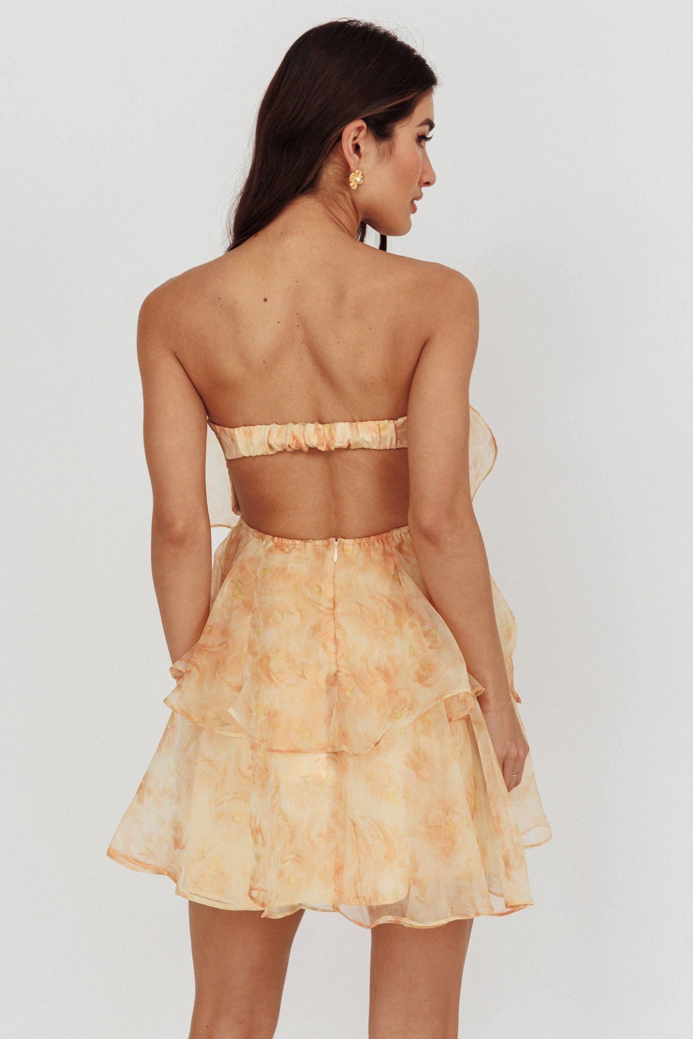 Amber Glow Chiffon Mini Dress with tiered skirt and open back, perfect for fall parties.