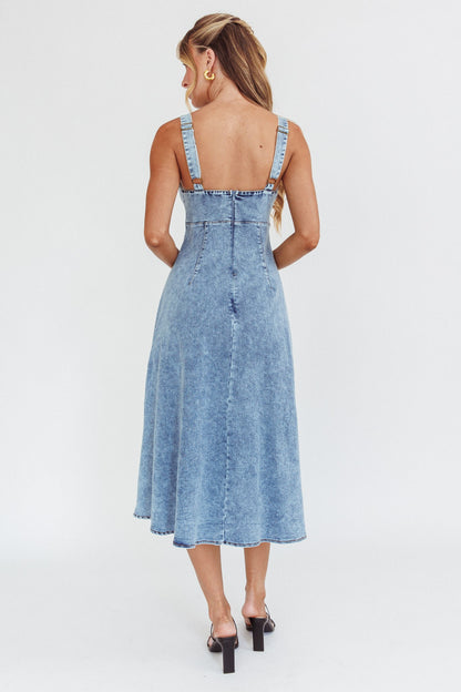 Autumn Breeze Denim Midi Dress in denim blue with sleeveless V neckline and open back, perfect for fall occasions.