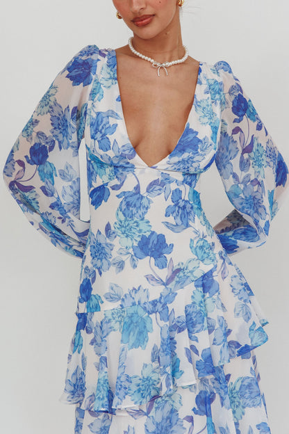 Long sleeve blue floral tiered maxi dress with deep V neckline and back tie wrap.