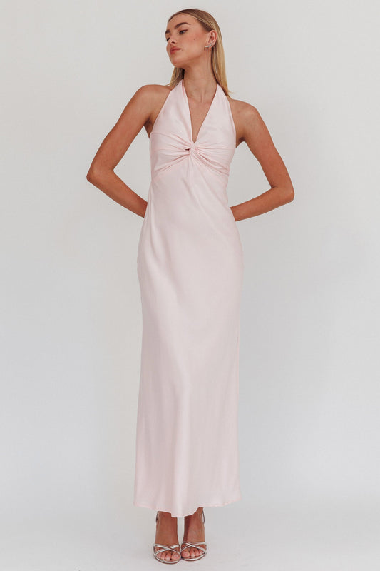 Halter neck front twist maxi dress in pink with open back and bow tie.