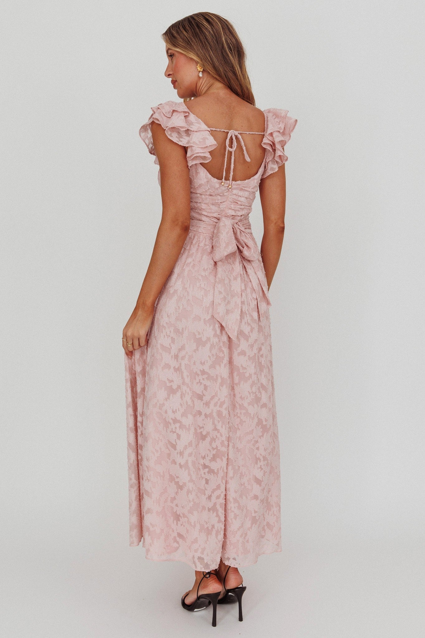 Blushing Crystal Embellished Maxi Dress with V neckline, waist wrap, and ruffle straps in blush.