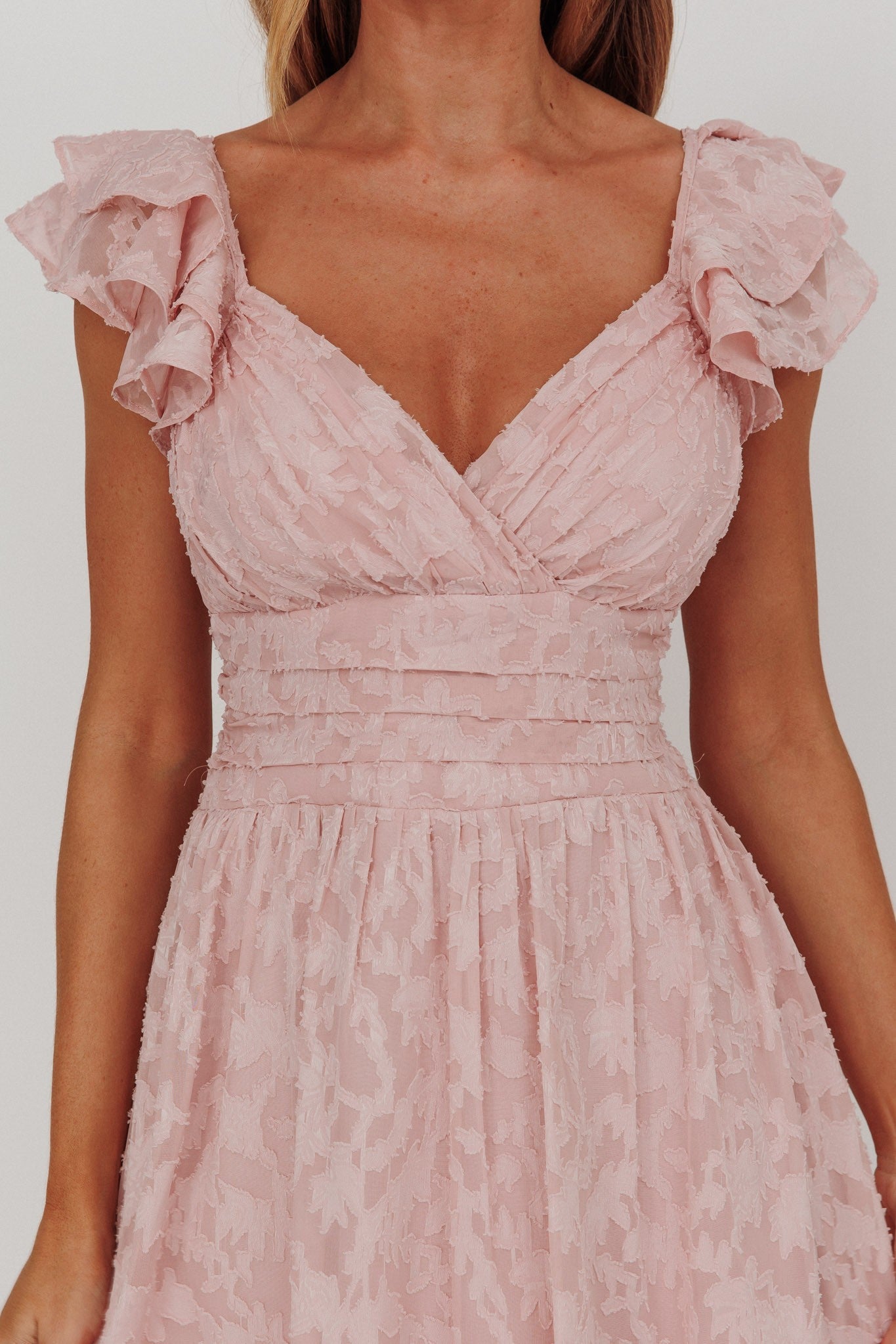 Blushing Crystal Embellished Maxi Dress with V neckline, waist wrap, and ruffle straps in blush.