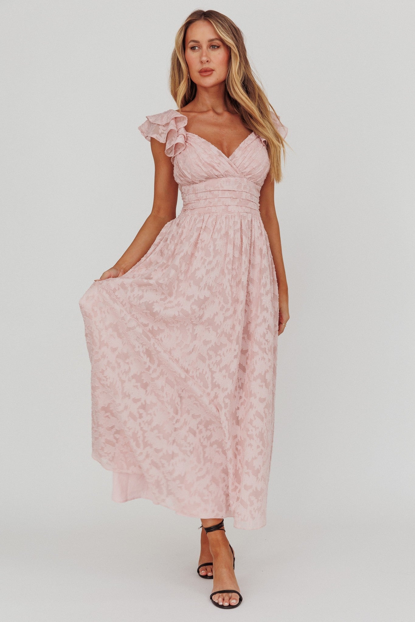 Blushing Crystal Embellished Maxi Dress with V neckline, waist wrap, and ruffle straps in blush.