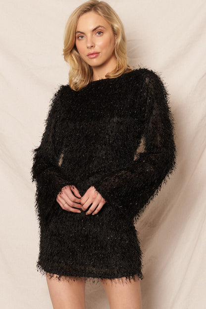 Black long sleeve mini dress with fluffy fringe details, ideal for festive events and New Year’s Eve.