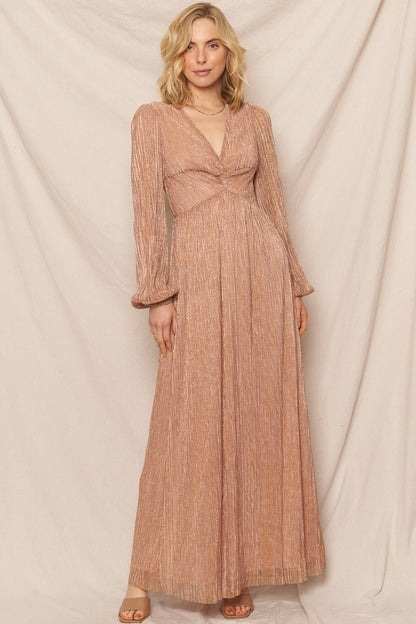 Blush gold shimmer maxi dress with a V-neckline and tie-back detail, perfect for festive and glamorous events.