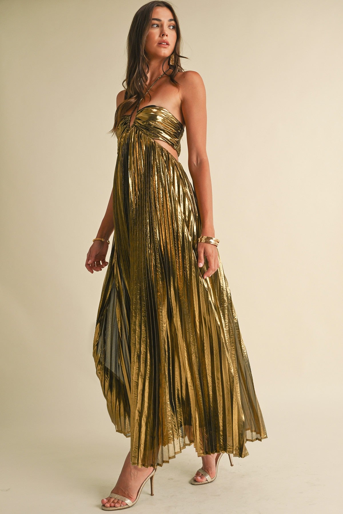 Golden Gleam Pleated Maxi Dress with all-over pleating, a halter neckline, and a luxurious metallic finish, in gold.