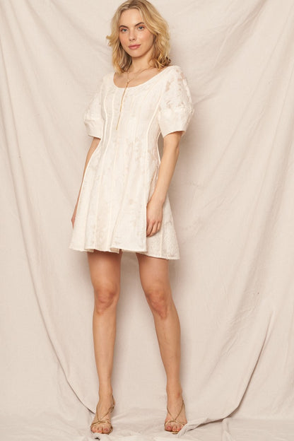 Ivory puff sleeve scoop neck mini dress with jacquard texture, ideal for special occasions and holidays.