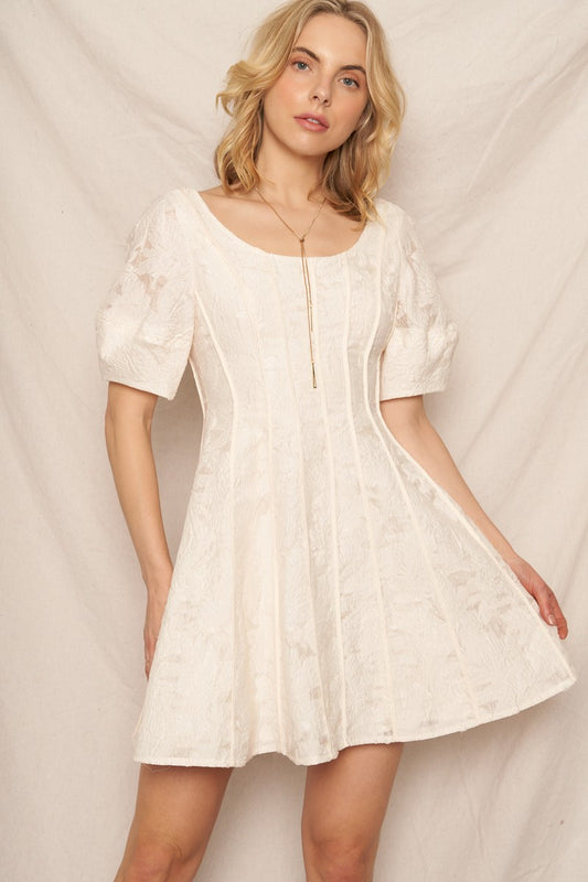 Ivory puff sleeve scoop neck mini dress with jacquard texture, ideal for special occasions and holidays.