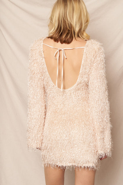 Cream long sleeve mini dress with fluffy fringe details, perfect for elegant holiday parties and New Year’s Eve celebrations.