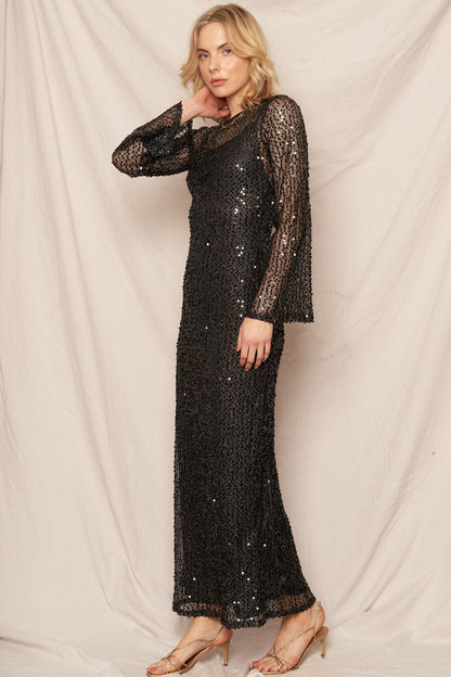 Black sequin maxi dress with elegant bell sleeves, perfect for New Year's celebrations and glamorous events.