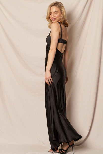 Black satin maxi dress with a sweetheart neckline, perfect for formal New Year’s Eve and holiday celebrations.