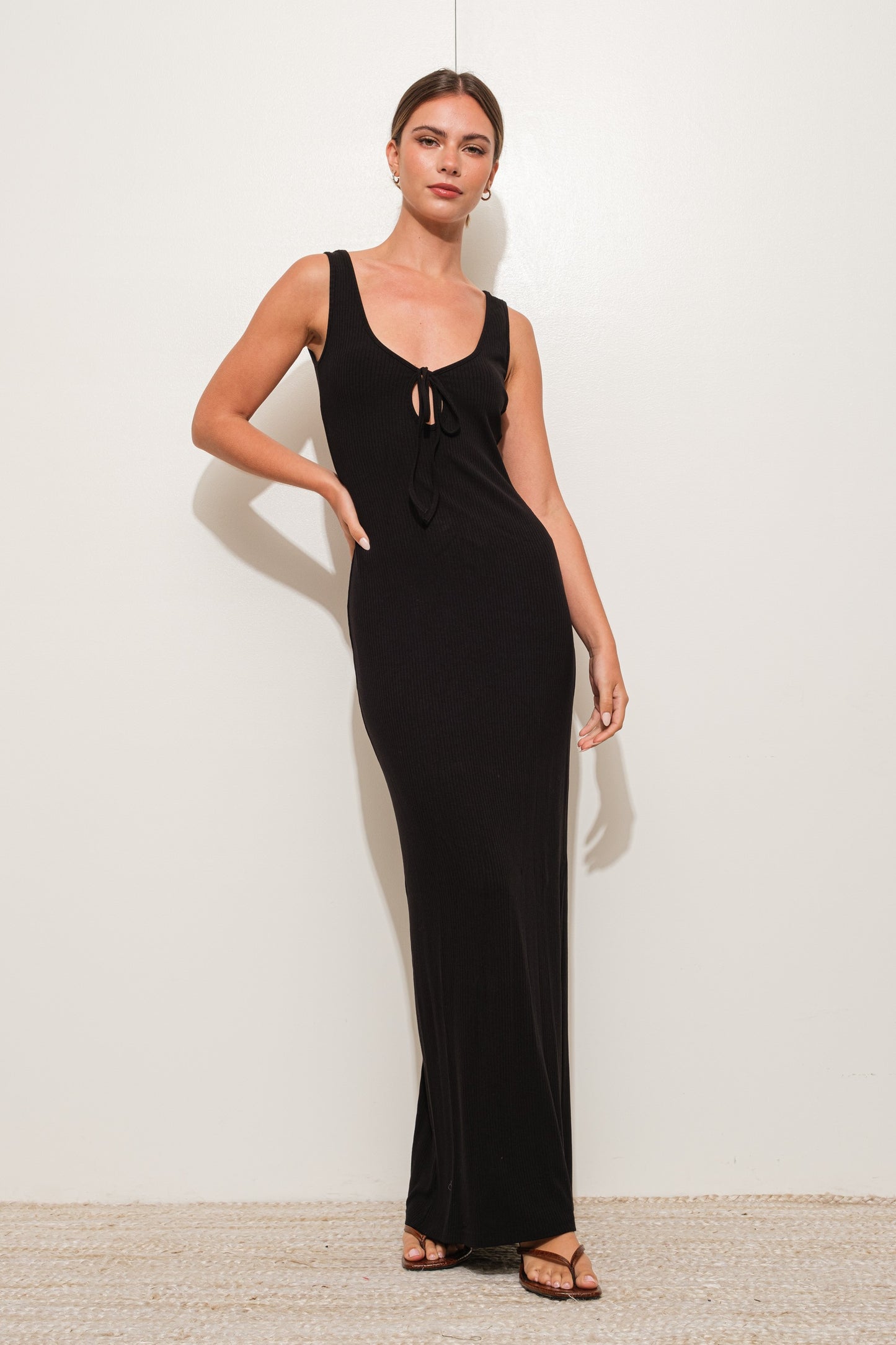 Onyx Peekaboo Ribbed Knit Maxi Dress in black with a peekaboo tie detail, perfect for fall.