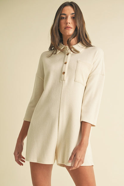 Soft Cream Knit Romper with long sleeves, button placket, and classic neckline. Ideal for casual daywear.