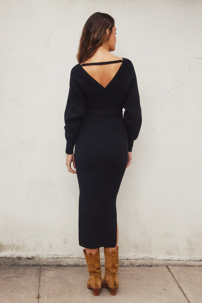 Elegant black knit midi dress with a wide surplice neckline, dolman long sleeves, and a sash belt, perfect for casual outings or Valentine's Day.