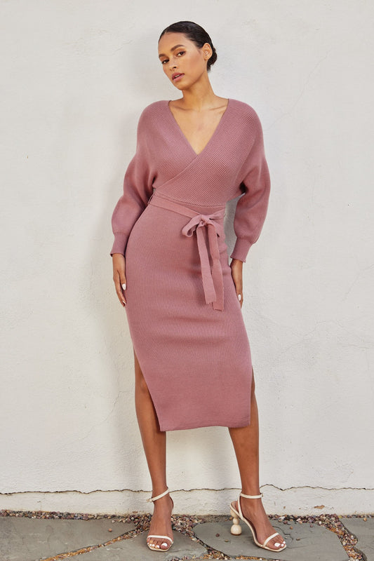 Elegant pink knit midi dress with a wide surplice neckline, dolman long sleeves, and a sash belt, perfect for casual outings or Valentine's Day.