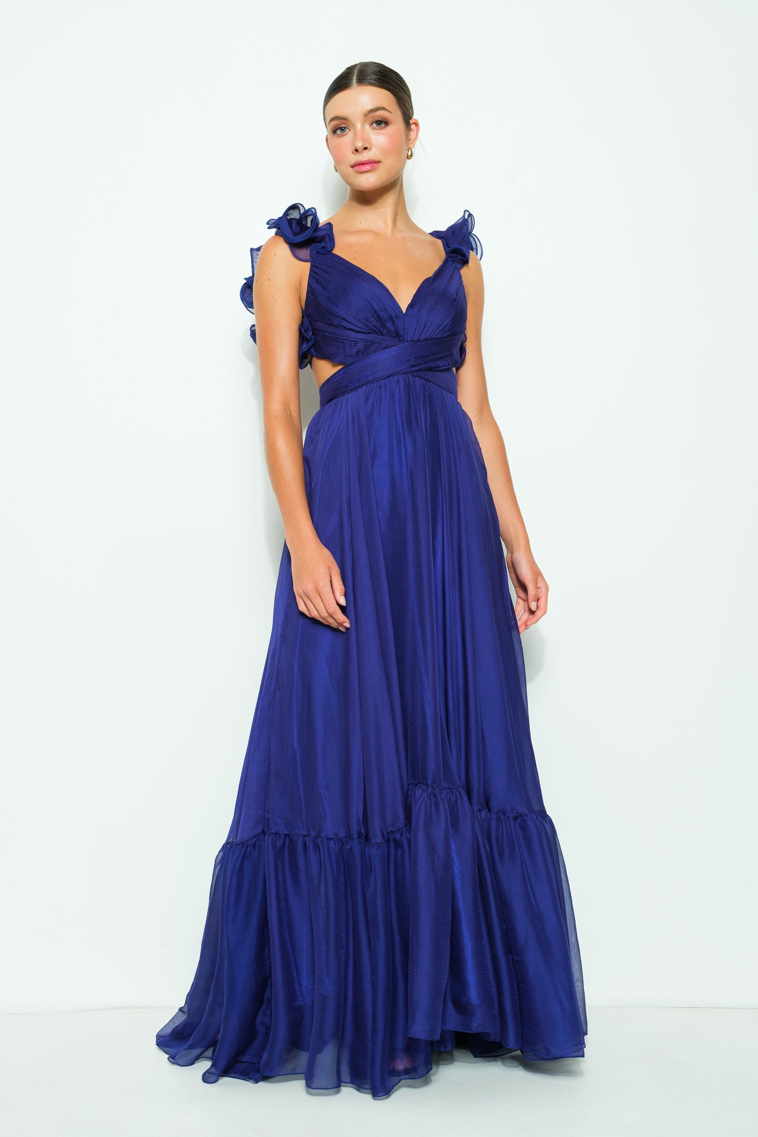 Front view of the Twilight Amethyst Maxi Dress, a chiffon ruffle shoulder V-neck maxi dress with a lace-up back detail, in a rich purple hue.