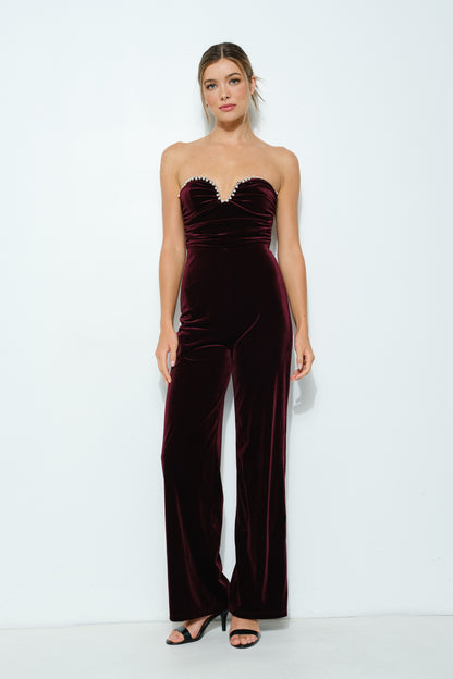 Velvet Elegance Pearl-Trim Jumpsuit in wine color, featuring a strapless sweetheart neckline, faux pearl trim, and wide-leg pants.