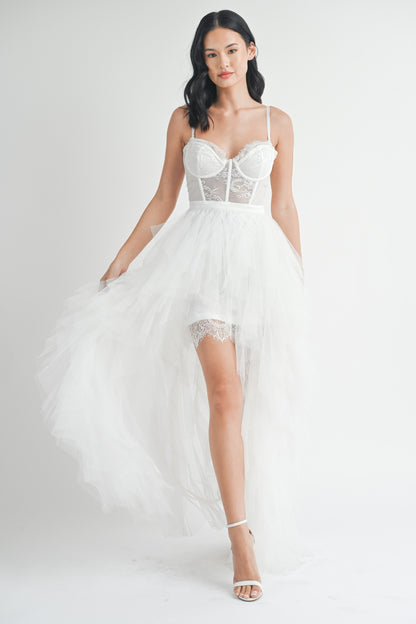 White strapless tulle maxi dress with a structured lace bodice, side slit, and ruffled mesh outer layer.