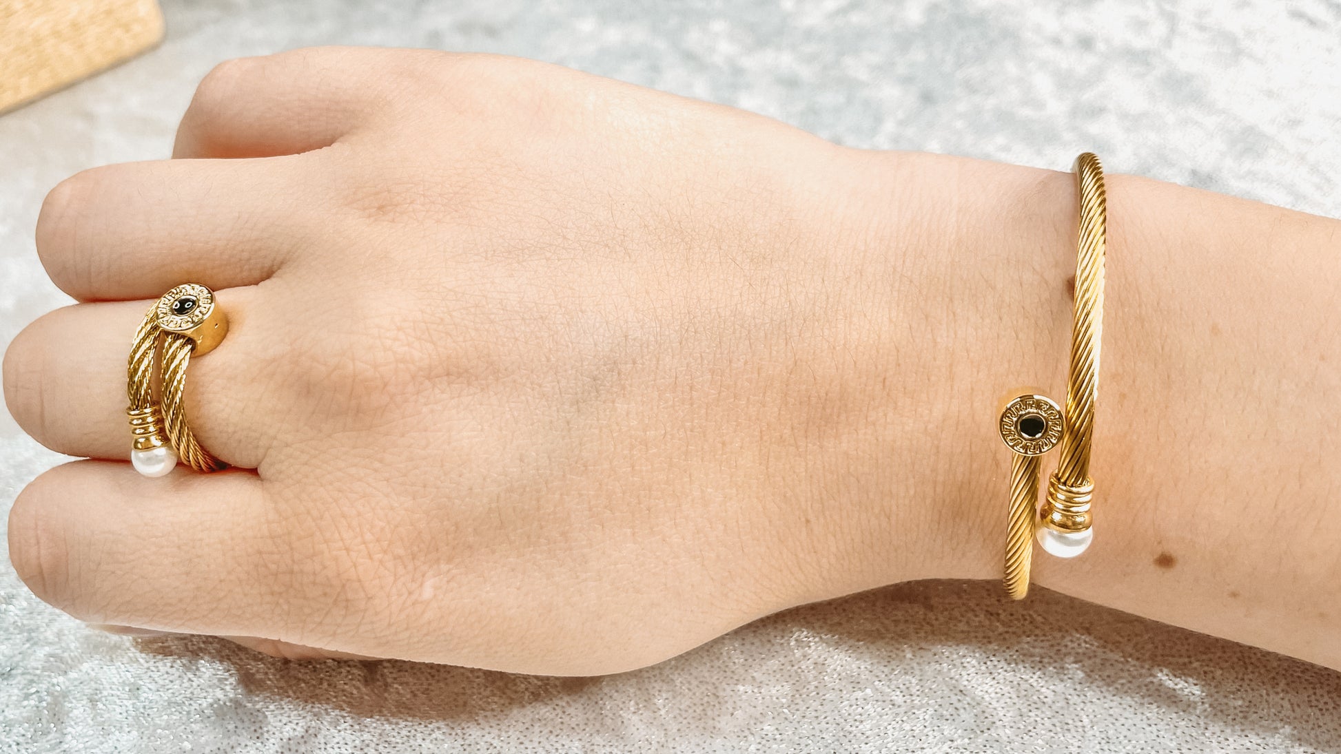 Gold cuff bracelet with ring